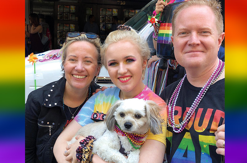Family and dog at LGBTQ+ Pride Parade