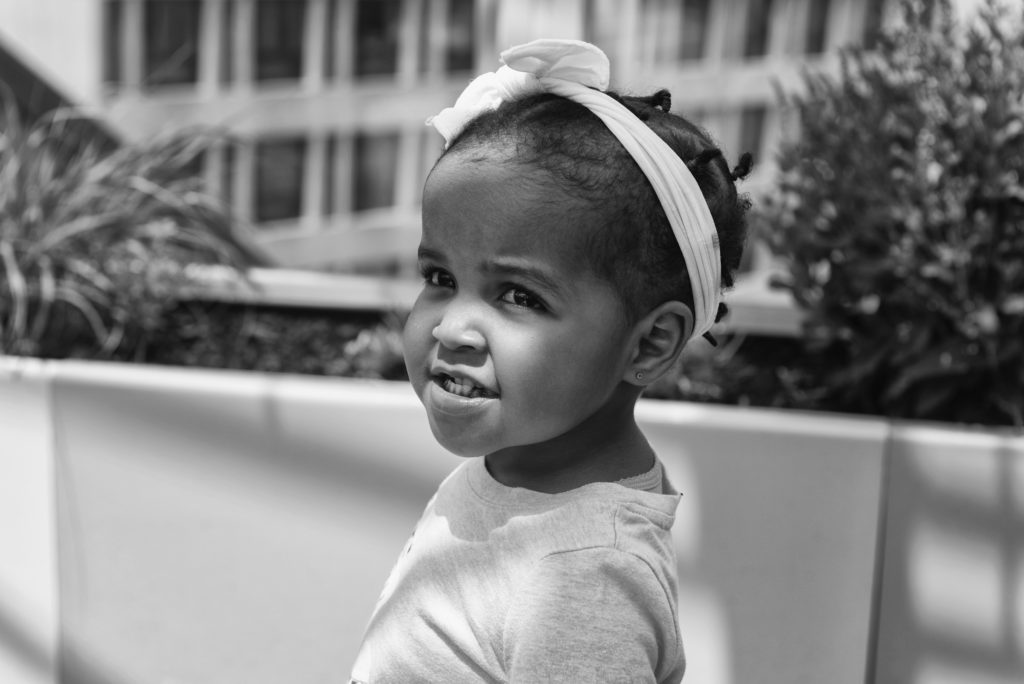 little girl with cdh in a garden
