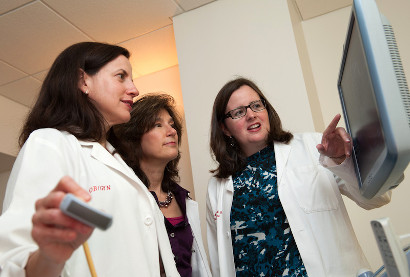 Dr. Valente discusses a case with colleagues