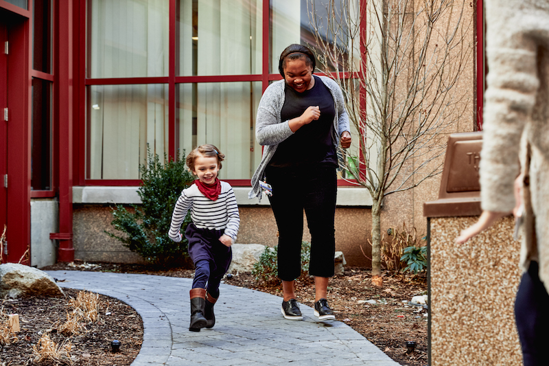program coordinator for midaortic syndrome center plays with a patient