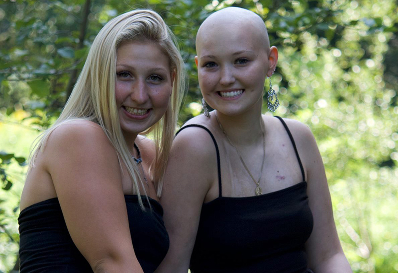 Darcey, who has Li-Fraumeni syndrome, sits outside with her friend Sarah