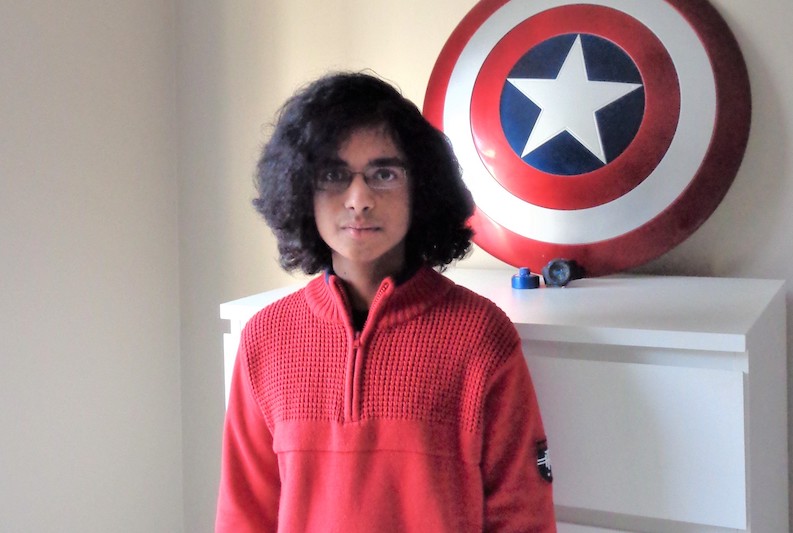 Ali, who had ALL, poses in his bedroom