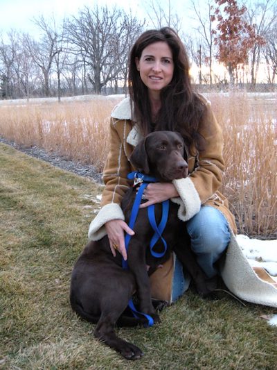 Alison Frase with Nibs, founder of the world's first myotubular myopathy dog colony