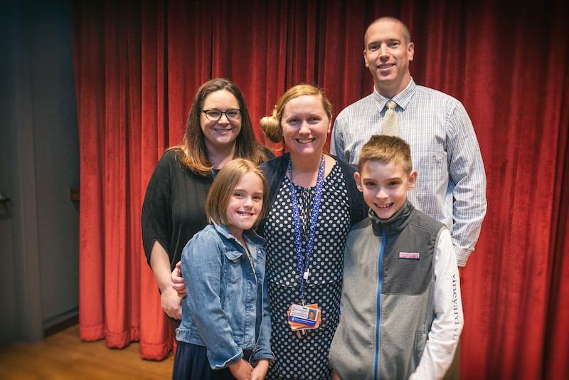 Jill poses with the Morris', one of the families who nominated her.
