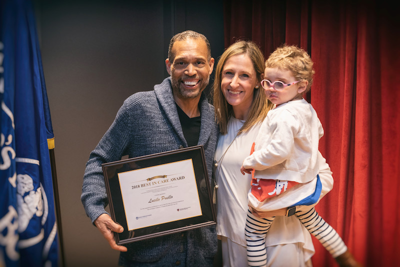 Lucilo with Kelly and Ellie White, the family who nominated him