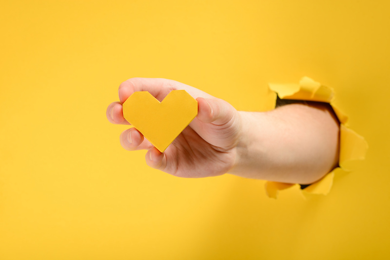 hand holding a heart represents support during urodynamics testing