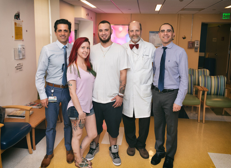 phalloplasty patient poses with his surgeons