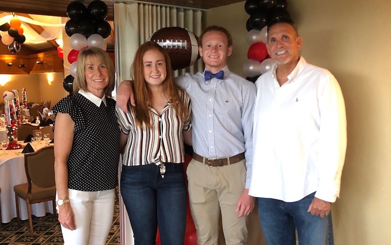 The Casey family pose in a banquet hall after Ryker's comeback from osteochondritis dissecans.