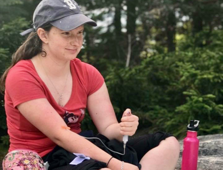 Morgan, who has hemophilia A, a blood clotting disorder, gives herself an infusion outside.
