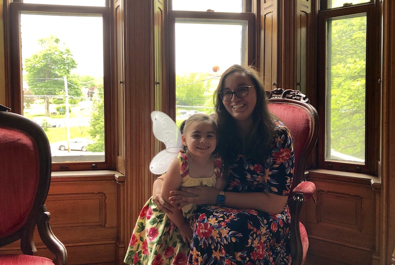 Grace, who had surgery for a cavernous malformation, poses with her mom.