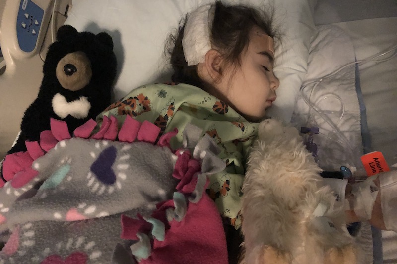 Grace, who had a cavernous malformation, in the hospital after surgery.