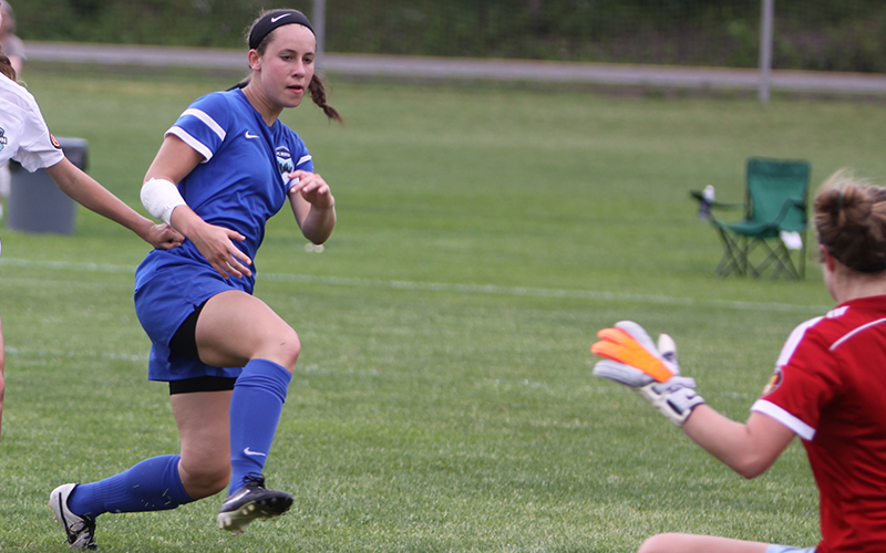 Emily, who had ACL reconstruction surgery, playing soccer.