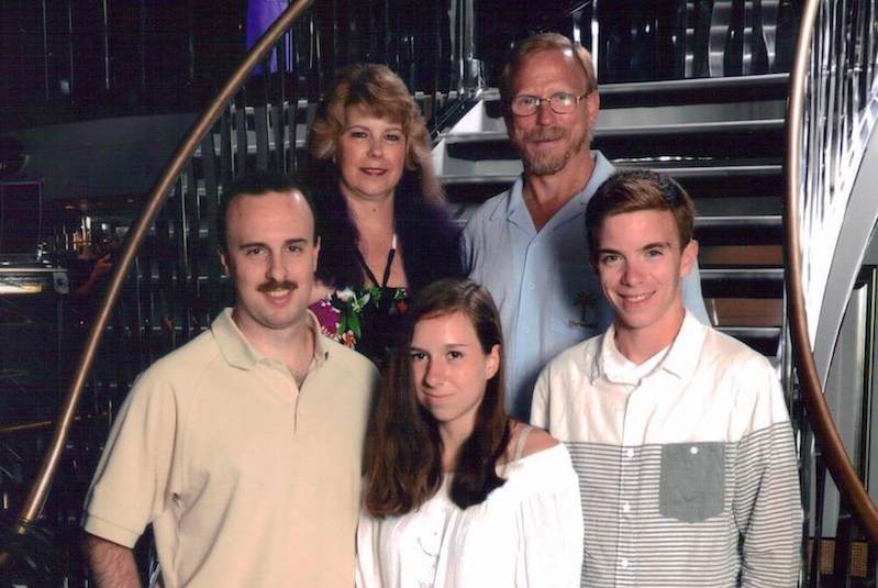 Felicia, who was diagnosed with familial paraganglioma-pheochromocytoma syndrome, poses with her family