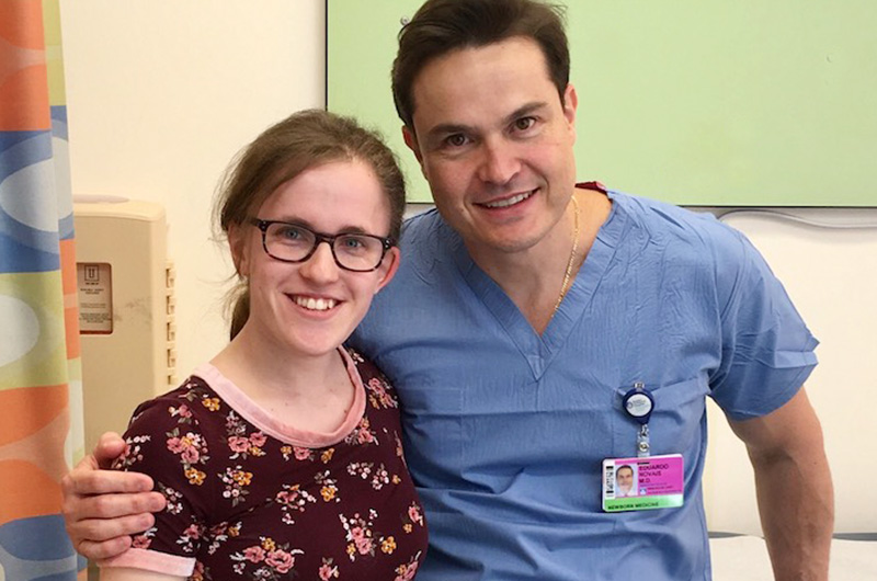 Lauren and Dr. Novais smile for the camera.