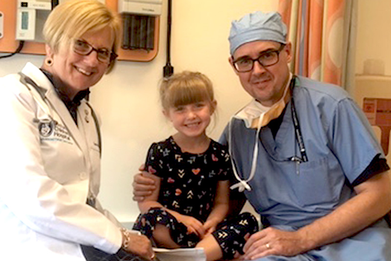 nurse donna morash visits with a patient