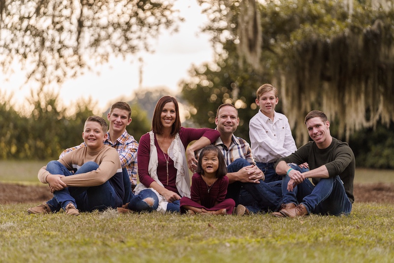 Faith, who had single ventricle surgery, poses with her whole family.