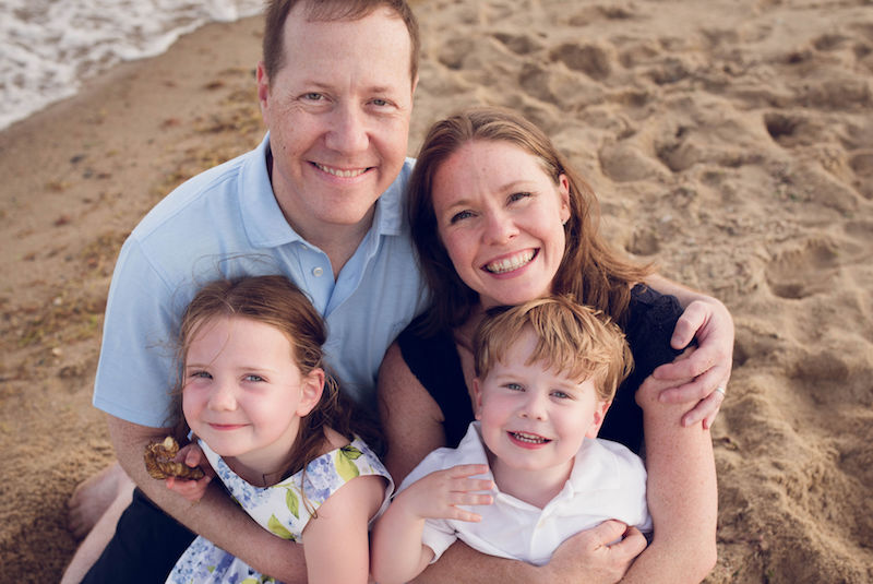 Colin, who has hemophilia, in a family photo on the beach.