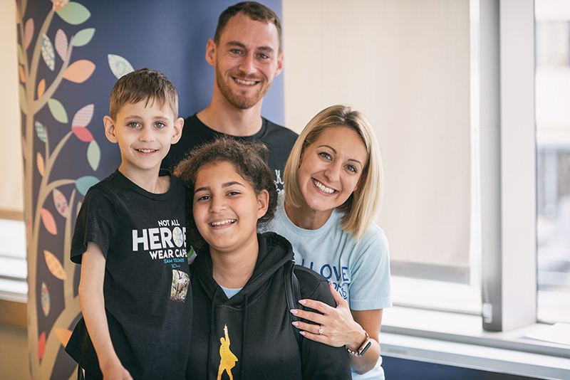 boy with dyskeratosis congenita poses with his family
