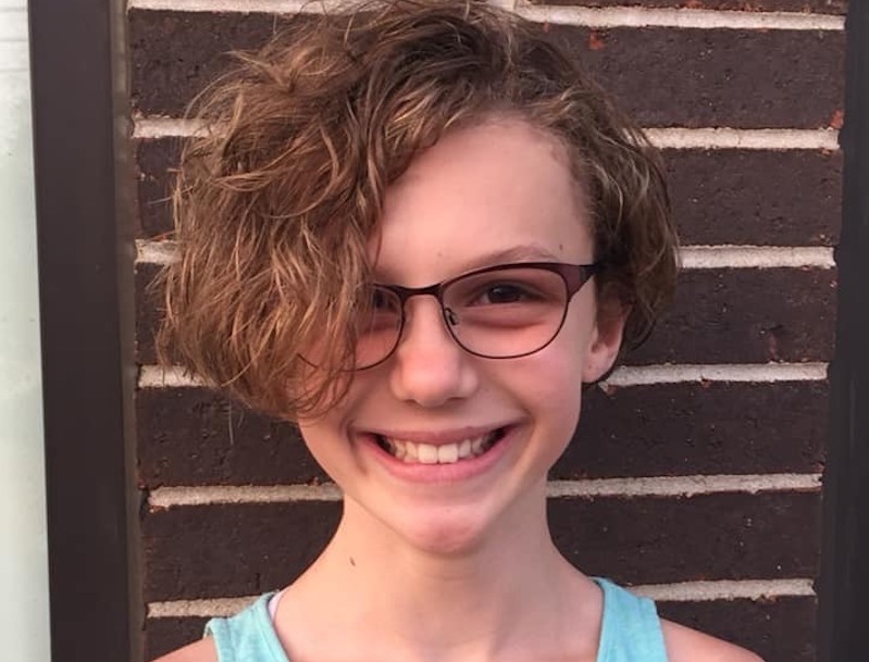 Lia, who was treated for a Wilms tumor, shows off her new haircut.