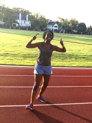 Louise, who had surgery for hip dysplasia, gives a thumbs up at the track.