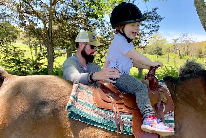 Ellery, who has opsoclonus myoclonus syndrome, rides a horse.