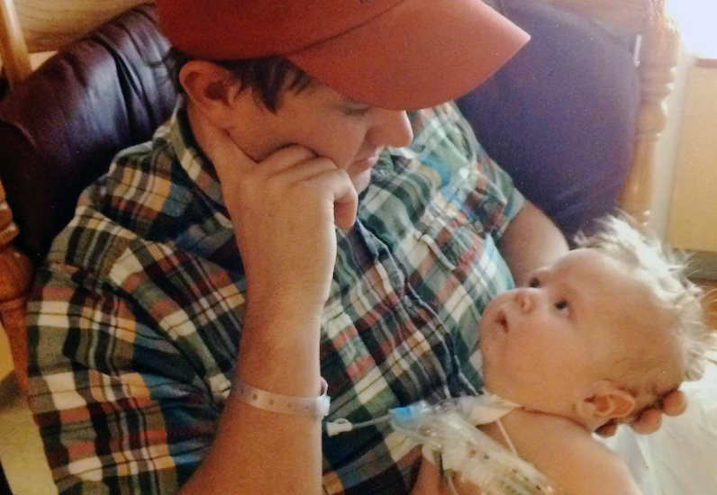Brett Lillywhite holds his son, Andrew who has Shwachman-Diamond syndrome.