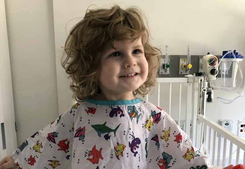 Lincoln Lillywhite, who was born with SDS, smiles from his hospital bed.
