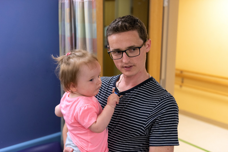 Sofie, who had gene therapy treatment for SMA, shares a moment with her dad.