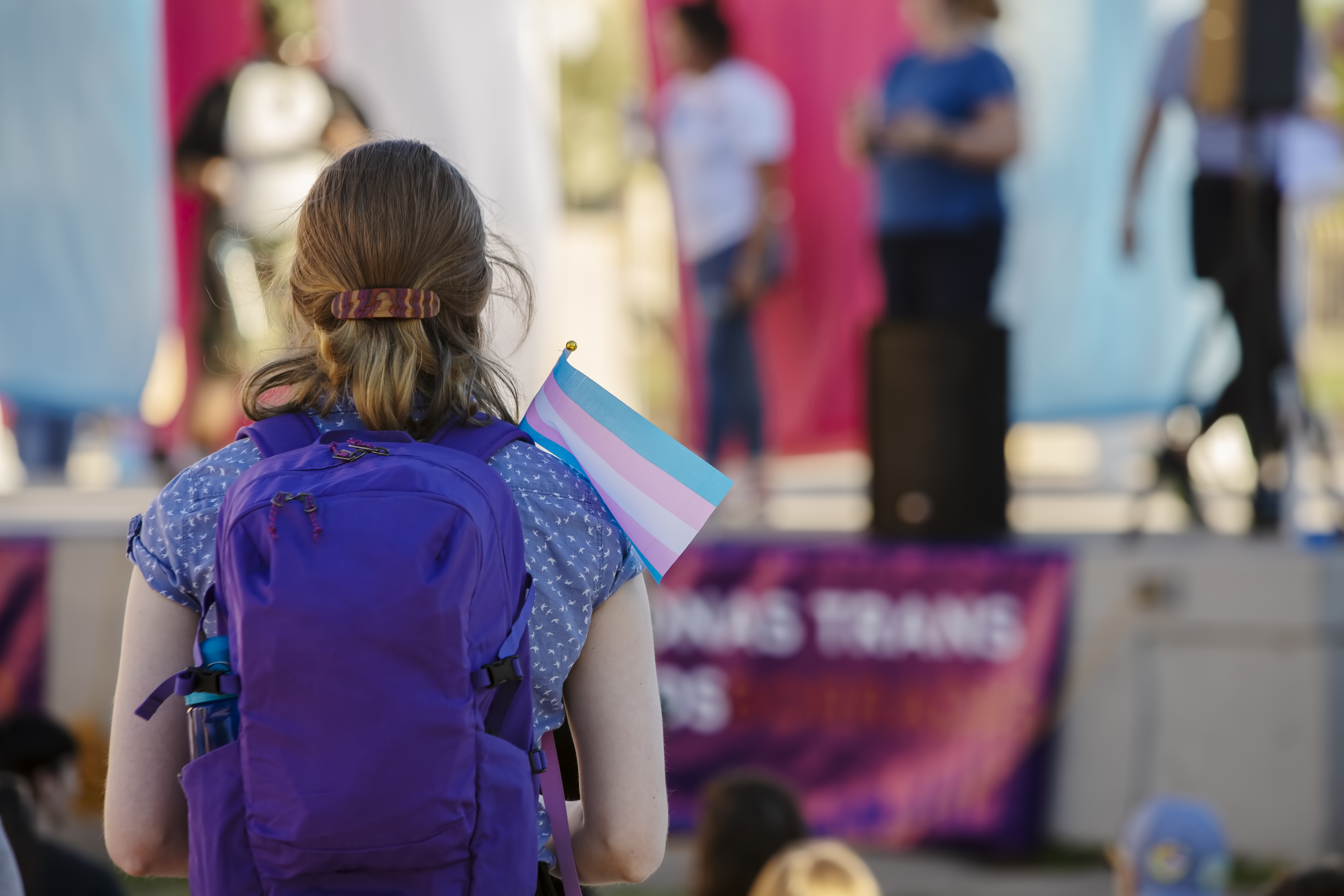 teen holding transgender flag