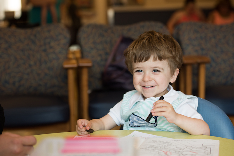 Jack draws in the waiting room before his G-tube removal