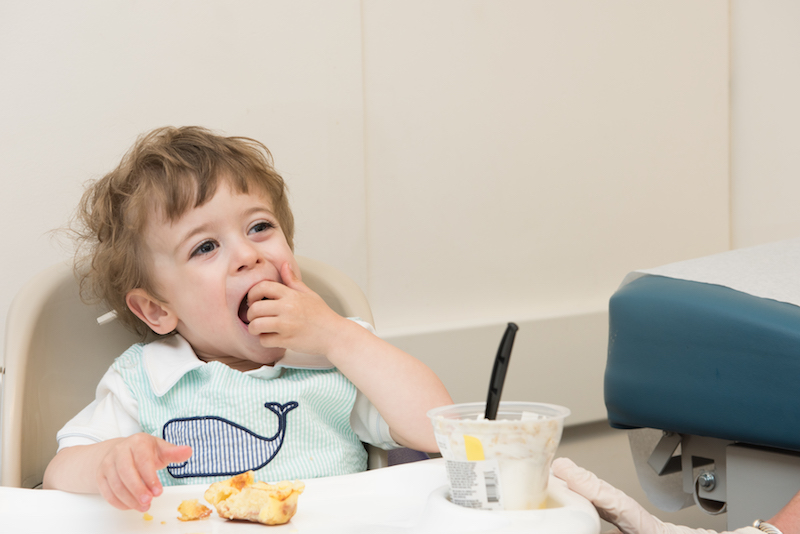 Jack samples some snacks at a feeding evaluation before his G-tube removal