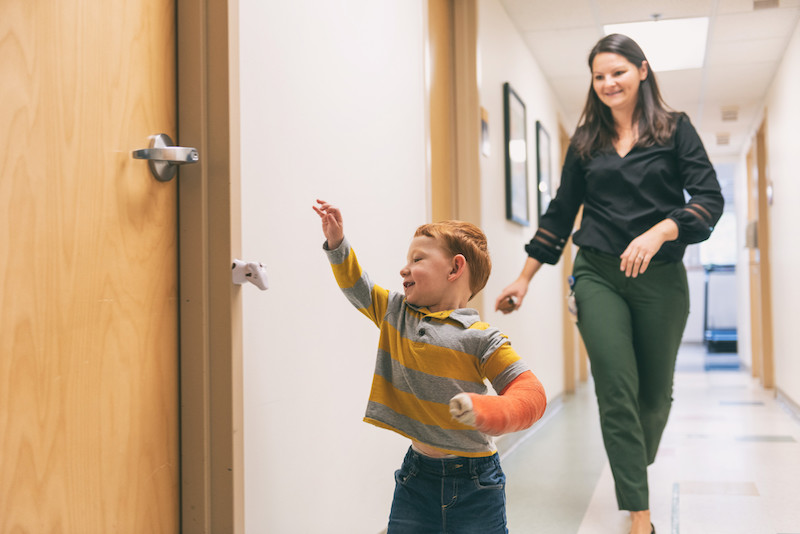 simon plays with julie malloy, his occupational therapist