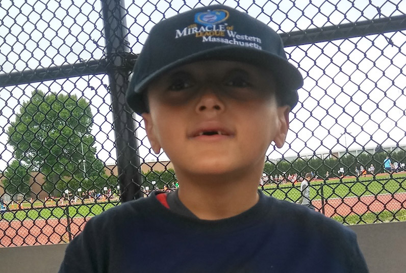 Julian, who had a kidney transplant, in a baseball field.