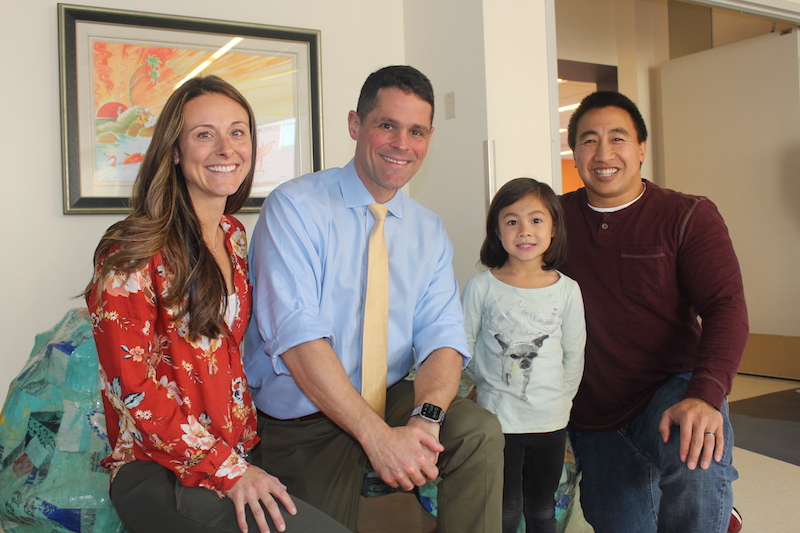 Kalea, who has moyamoya, poses with her family and the doctor who performed her surgery