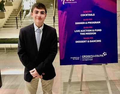Timmy, who has been inpatient during the holidays, poses at a gala opening