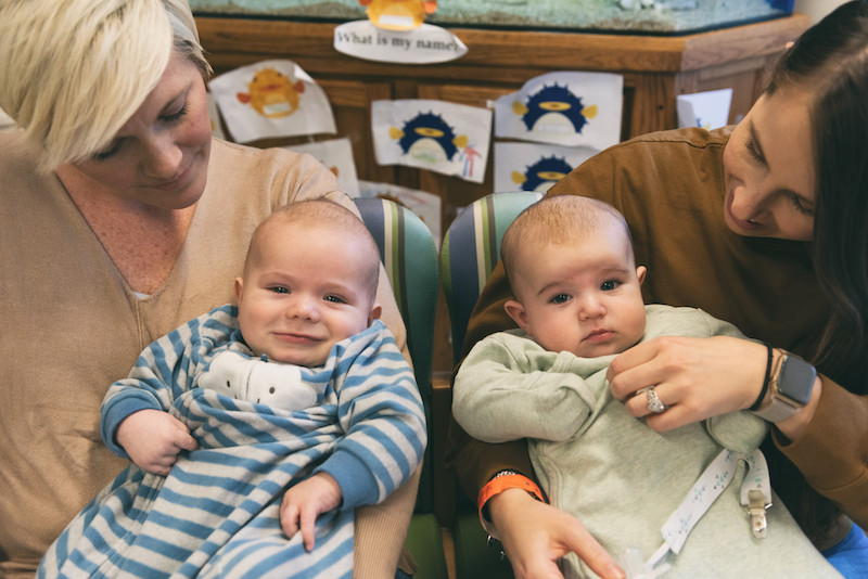 bladder exstrophy babies sit with their mothers