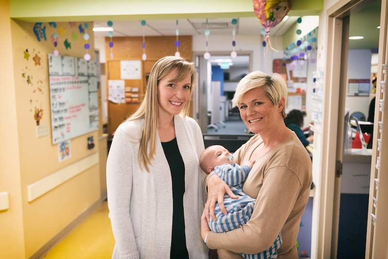 henry and his mom stand with bladder extstrophy nurse, lauren cullen