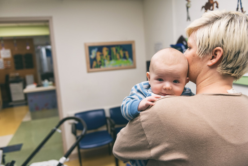 bladder exstrophy baby is held by his mom