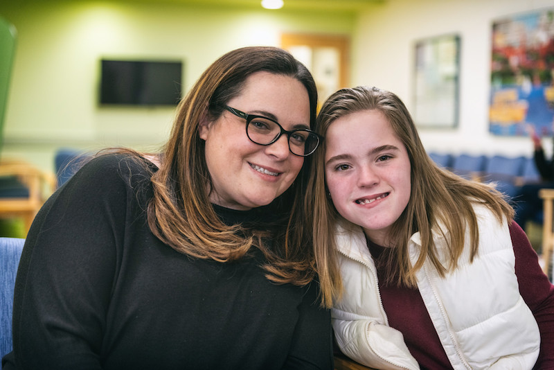 patient with laryngeal cleft poses with her mom