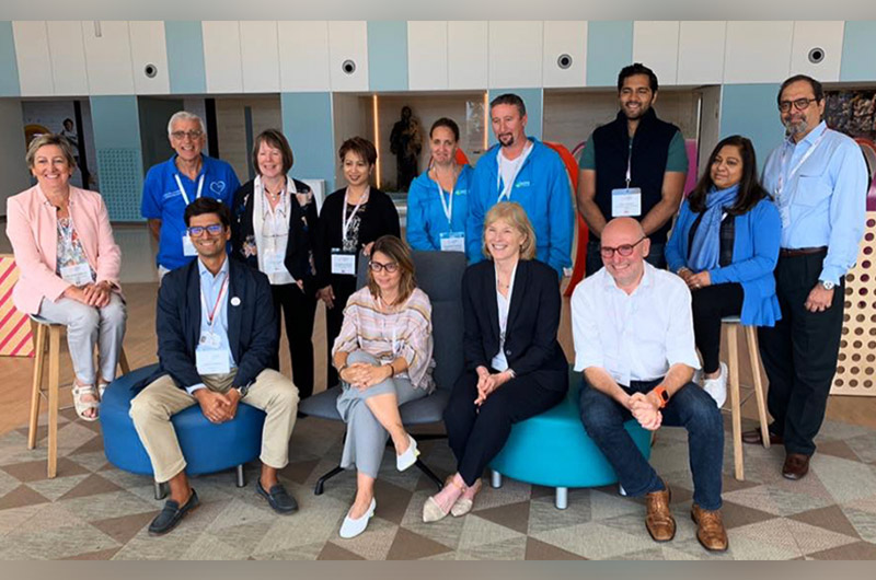 Members of GC Global pose inside during their conference in Barcelona, Spain.