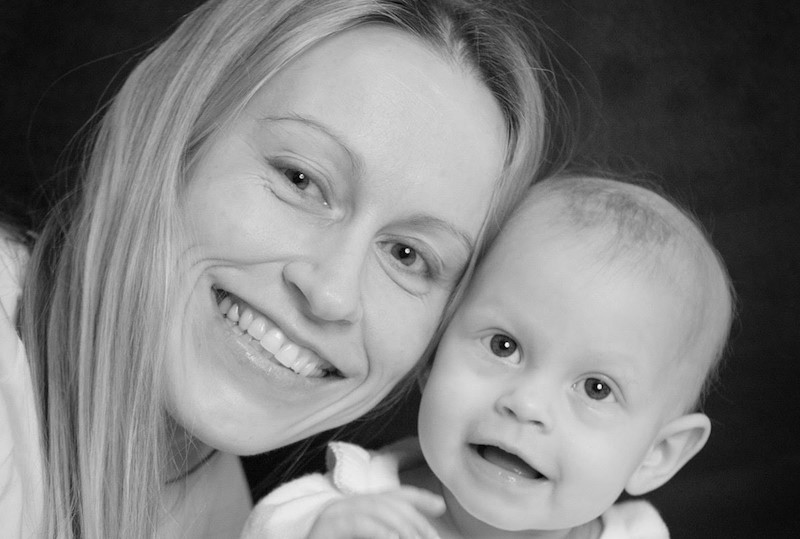Anabella, who had a malignant rhabdoid tumor, poses with her mom
