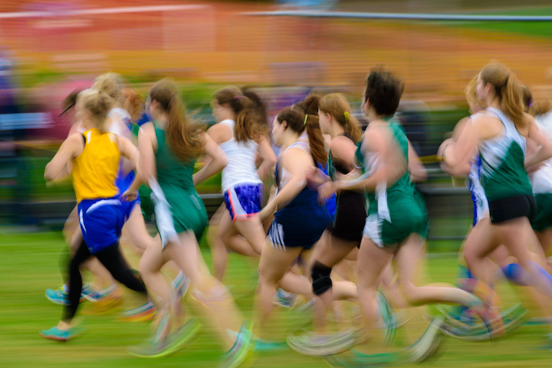 a group of cis and transgender athletes running