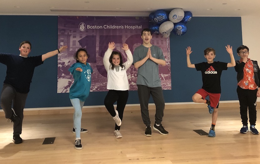 Six children try yoga poses