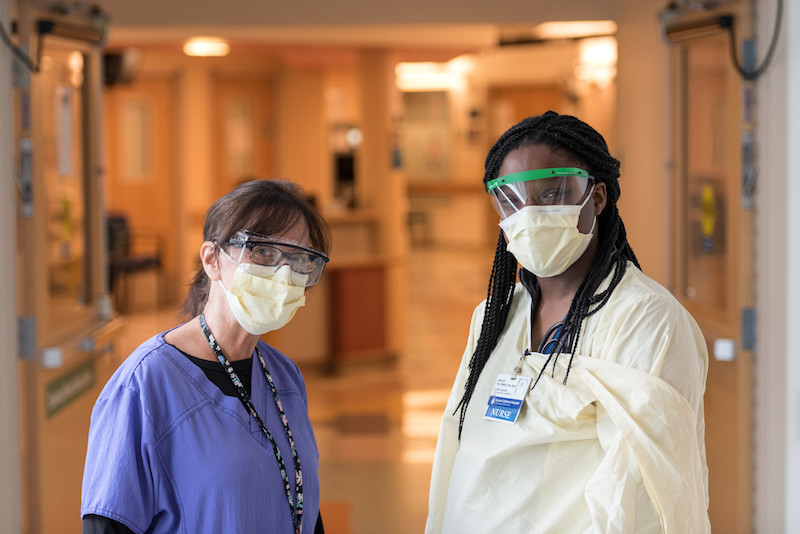 Two clinicians wearing masks at Boston Children's to prevent the spread of COVID-19.