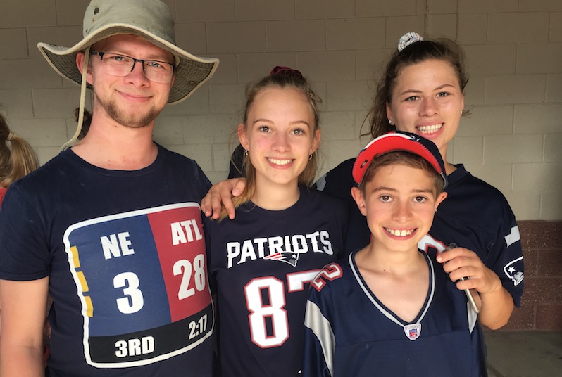Isolde, who has 3PD, with her siblings at a New England Patriots game
