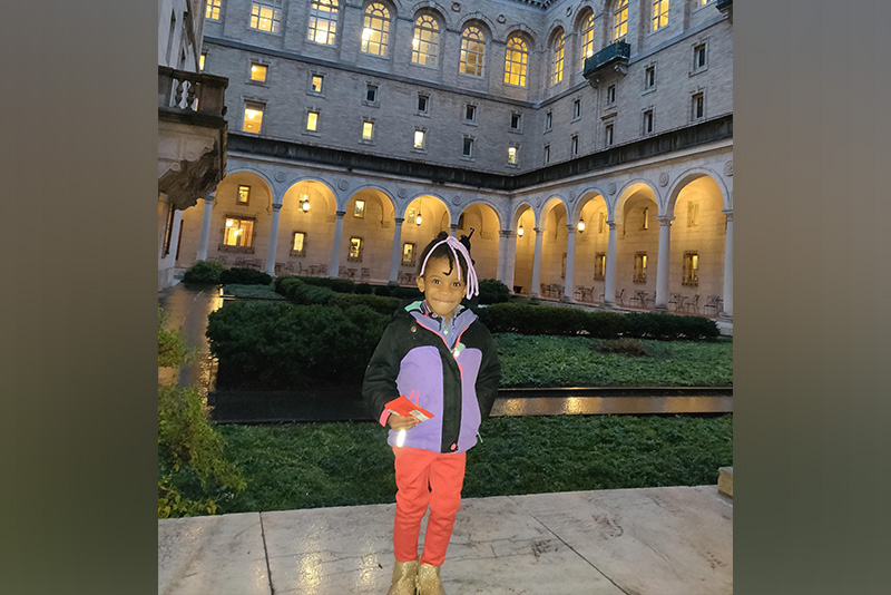 Sydney, who has renovascular hypertension, in a purple jacket