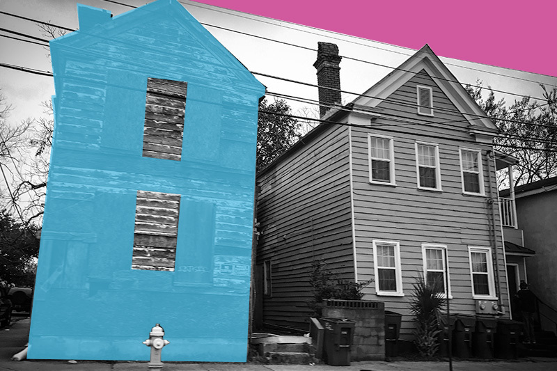 Two houses located very close together in an urban neighborhood.