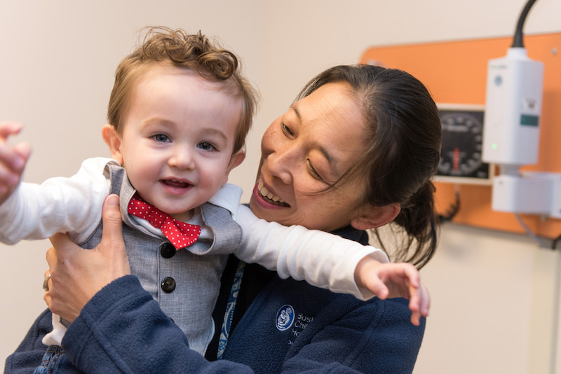Dr. Dickie holds a smiling Bryson