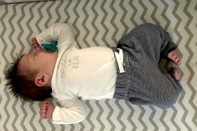 Gabriel, who was born with clubfeet, in his crib.