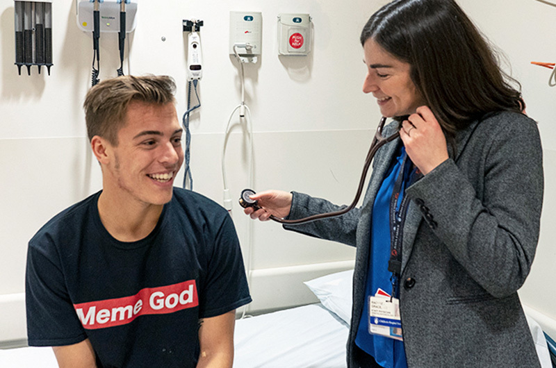 Jim, who has PK deficiency, at a checkup with his doctor.